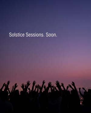 Teaser ad: a crowd's raised hands in silhouette at dusk