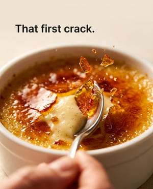 Macro shot: a spoon cracking the crust of a creme brulee