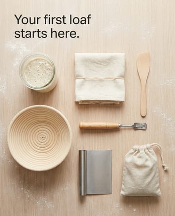 Knolling photo: a sourdough starter kit on a floury oak surface
