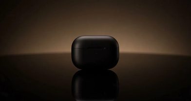 AI-generated cinematic product shot of a matte black earbud case on a dark reflective surface under a warm rim light