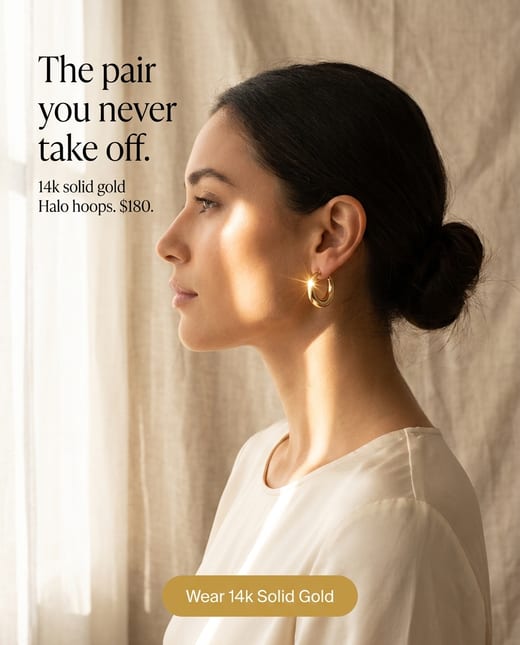 Editorial jewelry ad: a model wearing gold hoop earrings
