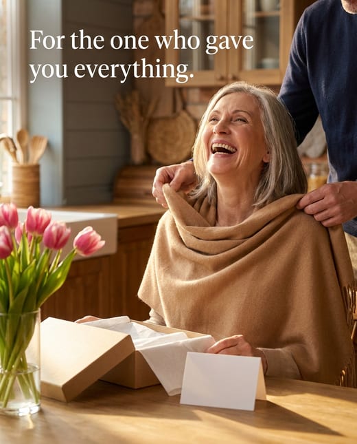 Gift ad: a son draping a cashmere scarf on his mother