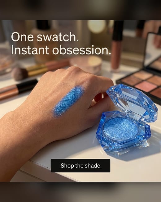UGC photo: an eyeshadow compact swatched on a hand at a vanity