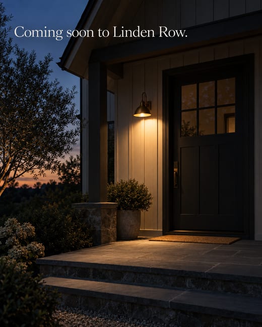 Coming soon teaser: a farmhouse front door half in shadow