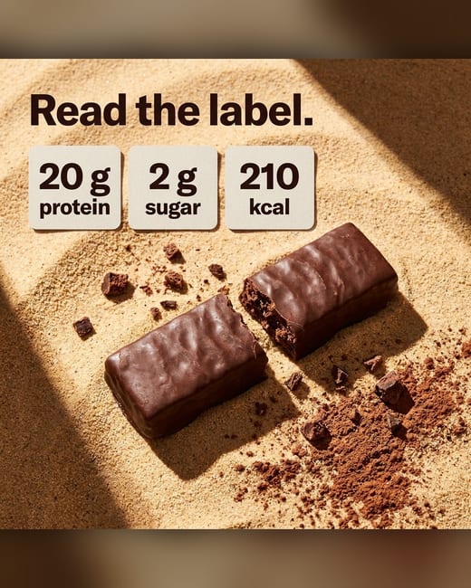 Stat ad: a protein bar snapped in half with nutrition stats