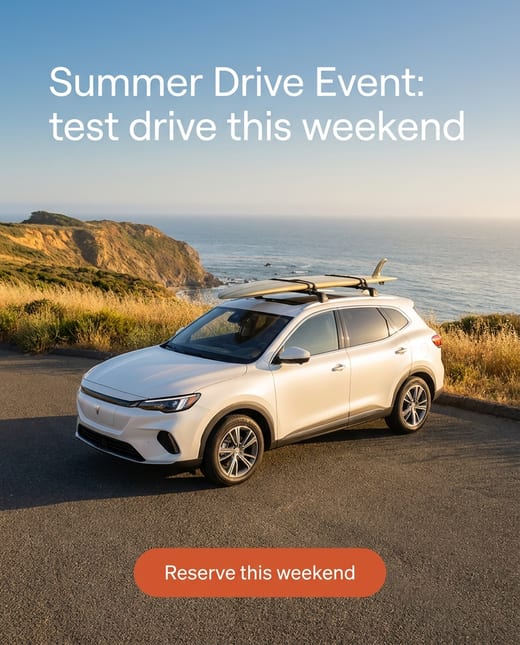 Summer sales event ad: an electric SUV at a seaside stop