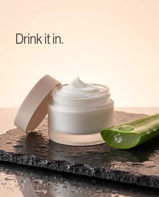 Beauty ad: a moisturiser jar with a swirl of cream and aloe