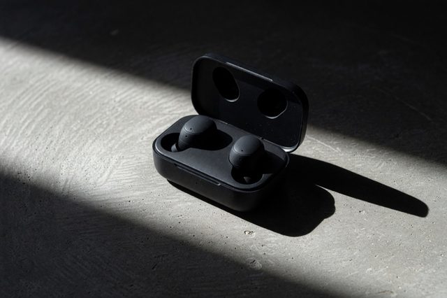 Earbuds on brushed concrete