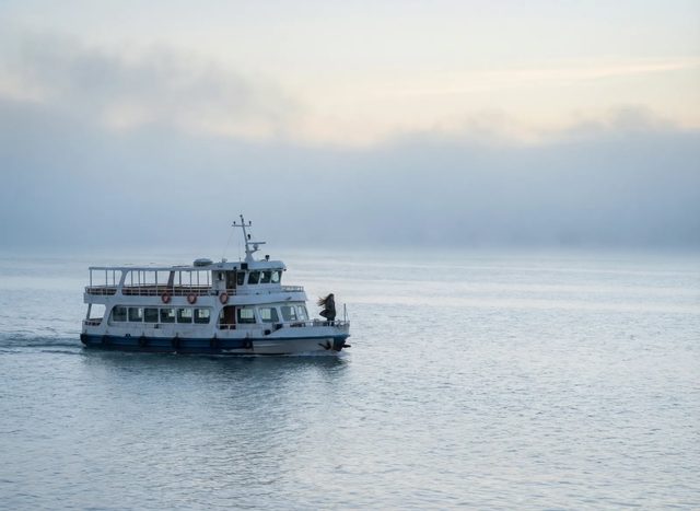 Ferry on grey water