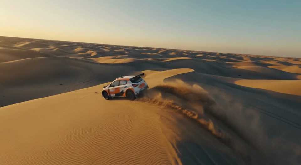 Rally car over a dune