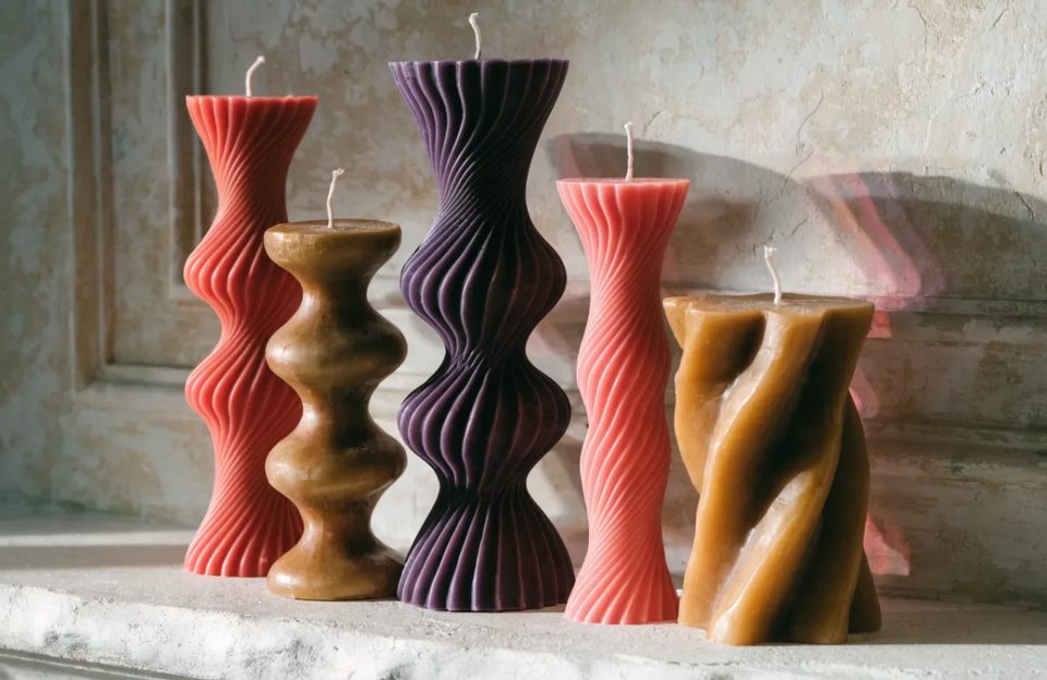 Twisted candles on plaster
